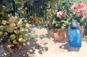 Giardino con annaffiatoio azzurro
